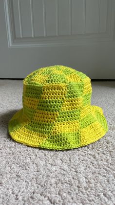 My lovely crochet bucket hat!  This hat has the perfect, classic bucket hat shape, and can come in any color.  Made out of 100% cotten yarn, they are very durable, while still being sustainable. You can even wear these in the pool and not worry about them getting wet, as long as they dry on your head/a similar shaped item to keep the origanal shape.  Can be fully customized, from size to color. Message me to design your custom bucket hat! Checkered Bucket Hat, Custom Bucket Hats, Crochet Bucket, Crochet Bucket Hat, In The Pool, Bucket Hats, To Color, Caps Hats, Bucket Hat