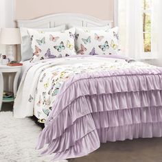 PRICES MAY VARY. This beautiful piece combines serene elegance with fashionable style. The top portion is created with a colorful array of graceful butterflies, while the bottom portion is clothed with gorgeous ruffles where the butterflies will eventually land to rest. Spoil your little one with colors, ruffles and butterflies! This enchanting quilt set brings bursts of imagination and fun to their bedroom decor. The inviting style of this quilt and generous size is the perfect bedding for your Butterfly Bedroom, Oversized Quilt, Butterfly Room, Big Kids Room, Butterfly Quilt, Lush Decor, Bedding Stores, Bed Sets, Reversible Quilt