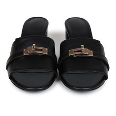 These Hermes Gigi 50 sandals are in Black calfskin leather with permabrass hardware, featuring a 2" heel, an iconic permabrass-plated Kelly buckle detail on front of sandal, natural leather soles, and are a size 37.5 EU. Origin: ItalyCondition: New and never worn (plastic on hardware)Accompanied by: Hermes box, dustbagsSize: 37.5 EU Hermes Birkin 25, Hermes Shoes, Rug Bag, Hermes Box, Birkin 25, School Bags For Kids, Backpack Tote Bag, Carry All Bag, Handbag Backpack