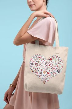 Thank you for visiting our shop ♡Beautiful 100% Cotton tote bag featuring a large white heart with the famous Portuguese love notes, Lencos dos Namorados pattern. Perfect for shopping, traveling, beach bag and more. Roomy, practical high quality cotton twill Tote Bag with shoulder length handles provides comfort with style in every situation.If you would would like the bag personalized with your name, let us know in the personalization field! Measurements:Tote measures 16 5/8" in length and 19" White Heart Print Bag As A Gift, Vacation Cotton Canvas Bag With Letter Print, White Gift Bag For Valentine's Day, Multicolor Embroidered Tote Shoulder Bag As Gift, White Valentine's Day Gift Bag, White Heart-shaped Everyday Bag, White Heart-shaped Travel Bag, Gift Letter Print Tote Shoulder Bag, White Heart Print Bag For Gifts