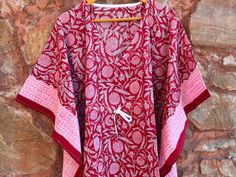 This Beautiful Hand Block Print Short Caftan or can be called as Tunic is made with super fine quality cotton and designs have been crafted by Handprints. Fabric - 100% Cotton Color - Red Pattern - Flower Block Print Size - Plus Size, can fit Up to 4XL Bust size - Free Size (Drawstring) Short Caftan- 35" Inches (Approx.) * It has Adjustable Drawstring Waist. * V Shape Neck Which is 8" Inches Deep. * Very comfortable to wear in both hot and cold weather. Note: The color and brightness of actual p Red Printed Motifs Summer Sets, Summer Red Printed Motifs Set, Red Summer Sets With Printed Motifs, Summer Red Sets With Printed Motifs, Red Summer Kurta With Printed Motifs, Summer Red Kurta With Printed Motifs, Red Kurta With Printed Motifs For Summer, Summer Cotton Sets With Kimono Sleeves, Cotton Sets With Kimono Sleeves For Summer