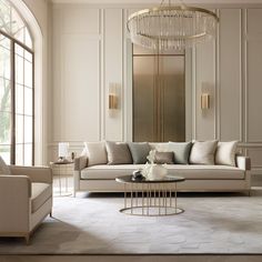 a living room filled with furniture and a chandelier