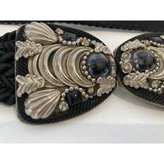 Judith Leiber Black Belt with Silver and Black Stones bubble Buckle. black cotton silk velvet waist belt. Categories : Women Category: Accessories Sub-category: Belts Material: Cotton Color: Black Buckle is 2" H x 4 " wide. Total Length 25 inches. Known for her amazing purses, Judith Leiber’s creativity continued with accessories such as this beautiful estate adjustable belt from the 1980s with semi-precious stone-studded. Hungarian born Judith Leiber (1921-2018) was known as the handbag designe Black Stones, Judith Leiber, Stone Studs, Silk Velvet, Adjustable Belt, Black Stone, Black Belt, The 1980s, Waist Belt