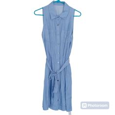 Cupshe Women's Belted Sleeveless Shirt Dress V Neck Button Front Dresses Casual Summer Color: Blue Size: Medium Spring Casual Sleeveless Collared Dress, Knee-length Sleeveless Dress With Button Closure For Daywear, Sleeveless Summer Vacation Shirt Dress, Sleeveless Shirt Dress For Summer Vacation, Sleeveless Shirt Dress For Spring Vacation, Blue Sleeveless Shirt Dress For Day Out, Sleeveless Shirt Dress For Summer Daywear, Sleeveless Shirt Dress For Summer Day Out, Casual Sleeveless Shirt Dress For Vacation