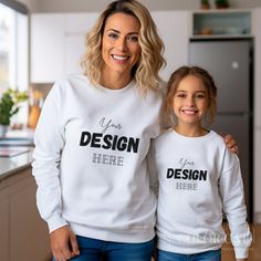 "Cute Mom & Me Mockup featuring Mommy and doughter in the kitchen, front view for Gildan 18000 White Sweater. This sweatshirt mock is a simple image that is easy to use with Canva, Photoshop, Photopea etc. to make a perfect mockup for your print on demand design. ♥ Our Mockups are designed to perfectly fit Etsy's new square listing image size. --------------------- ♥ We specialize in unique settings and product colors. If you like our mockups, do not forget to follow our shop to be informed about our new designs! --------------------- ♥ How to get your Mockup: - After purchasing, you can download a PDF with a Google Drive link to your images from your Etsy account or confirmation email. - Please note that all listings have a separate PDF and you will need to open each link separately if yo Customizable Family Matching Crew Neck Sweatshirt, White Long Sleeve Tops For Family Occasions, Customizable Family Matching Cotton Sweatshirt, Family Matching White Long Sleeve Sweatshirt, White Long Sleeve Sweatshirt For Family Matching, White Long Sleeve Family Matching Sweatshirt, White Relaxed Fit Sweatshirt For Family Matching, Kitchen Front View, White Long Sleeve Tops