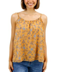 Yellow Floral Cami Beautiful and flowy, the new Mustard Floral Ruffled Swing Cami brings an easy elegance to your cool weather style! This flowy cami top features a warm yellow floral print with soft pops of blue and cream that are sure to brighten up any fall day. The swingy silhouette and dainty ruffle along the neckline make this cami top a comfortable, flattering, new favorite go-to for the season! Why you’ll love it: Flowy spaghetti strap mustard floral cami top with feminine, swingy silhou Yellow Floral Print Tank Top For Spring, Summer Yellow Floral Print Tank Top, Casual Flowy Spaghetti Strap Top, Casual Printed Camisole, Flowy Cami Top For Vacation, Flowy Spaghetti Strap Top For Day Out, Flowy Camisole Top For Vacation, Flowy Casual Camisole For The Beach, Casual Flowy Camisole For Beach