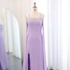 This Dreamy Vow Arabic Lilac Mermaid Evening Dress with Cape Sleeves SS448 is a luxury formal gown perfect for weddings and special occasions. The intricate beading and delicate lace details add a touch of elegance, while the mermaid silhouette and cape sleeves flatter the figure. Make a statement in this stunning dress. Arabic Evening Dress, Evening Dress With Cape, Dress With Cape Sleeves, Yellow Evening Dresses, Grey Evening Dresses, Champagne Evening Dress, Dress With Cape, Green Evening Dress, Gold Evening Dresses