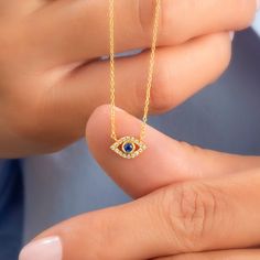 14k Gold and diamond evil eye necklace with sapphire, ruby and emerald center stone options. Diamond: 0.10 ct diamond Charm Measurements: 10 mm x 5 mm ( 0.4 inch. x 0.5 inch ) Chain: 1.1 mm link chain Chain length: 14+2 or 16+2 inch options ( Please let us know if you want a different length) Color: G Quality: SI-VS Additional Notes: * Non-Conflict Diamonds * Made in the USA C U R R E N T ∙ T U R N A R O U N D Processing Time: 1-2 weeks Within United States: approx. 3-5 biz days (faster shipping Evil Eye Diamond Jewelry As Gift, Diamond Evil Eye Jewelry Gift, Evil Eye Diamond Jewelry Gift, Sapphire Diamond Necklace As A Fine Jewelry Gift, Sapphire Diamond Pendant Necklace For Gift, Sapphire Diamond Necklace As A Gift, Sapphire Diamond Necklace Fine Jewelry Gift, Sapphire Diamond Necklace For Gift, Diamond Evil Eye Pendant Necklace