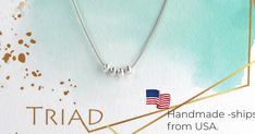 a silver necklace with three charms hanging from it's side and the words, handmade - ships from usa