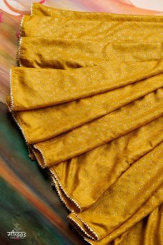 "Gorgeous Mustard Tussar Silk Saree with allover dense Mukaish Embroidery. The saree is a class apart piece of art & an Heirloom Collectible!! Beautiful supple Tussar Silk saree has been adorned with innumerable stars of Mukaish. This is a very high quality handcrafted Mukaish saree, unlike most of work that is now available in the market. Each dot of Mukaish has been finely rubbed to make them settle properly in the fabric & invoke beautiful lustre. The saree is dyed a lovely shade of Mustard Yellow & finished with Gold Zari Gota Lace (tested & pure). This saree is now MADE ON ORDER and will take maximum 13 weeks to get made after placing the order. Message us if you wish to customise the colour of the saree to your preference. THE SUSTAINABILITY QUOTIENT (TSQ): 1. Very fine quality herit Semi-stitched Gold Pre-draped Saree With Dupatta, Festive Tussar Silk Sharara With Gota Work, Gold Pre-draped Saree With Cutdana For Navratri, Gold Pre-draped Dola Silk Saree With Dupatta, Bollywood Style Gold Pre-draped Saree With Pallu, Gold Anarkali Banarasi Silk Pre-draped Saree, Festive Party Blouse Piece In Tussar Silk, Festive Party Tussar Silk Blouse Piece, Festive Yellow Raw Silk Pre-draped Saree