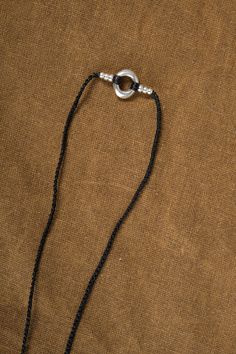 This unique Birdbone on Long Gortex Necklace by Jill Platner features sterling silver pieces stacked on a crocheted cord for a statement-making look. The O-ring clasp adds a touch of functionality to this handcrafted piece, which may vary in size and color, making each necklace a one-of-a-kind creation. Elevate your style with this expertly crafted necklace. Silver Lariat Jewelry With Adjustable Cord, Artisan Silver Jewelry With Adjustable Length, Everyday Nylon Cord Jewelry, Everyday Nylon Cord Bracelet, Everyday Adjustable Nylon Cord Jewelry, Everyday Jewelry With Adjustable Nylon Cord, Adjustable Everyday Jewelry Bracelet, Minimalist Everyday Jewelry With Adjustable Cord, Artisan Hand Knotted Adjustable Jewelry