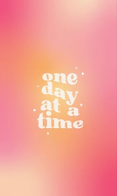 the words one day at a time are written in white on a pink and orange background