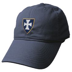 a blue hat with a white cross on the front and yellow trim around the peak