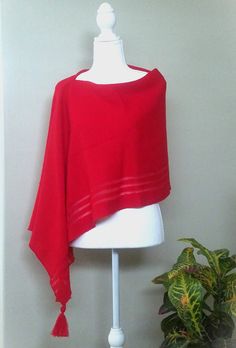 This red merino wool poncho is very elegant and is suited to complement different outfits, it is also suitable for weddings or other formal events in your life. It's the simplest way to add some colour and freshness to your wardrobe and stylize your everyday garments. A great gift for a loved one.    Knitted 100% merino wool ponchos. The poncho is available in one size. ❤️ Several wearing variants: as poncho, scarf, headgear, beach tunic, scarf, cape, vest and etc. ❤️ Handmade with love for you Gift wrapping available.  Hand washed in lukewarm water with delicate detergent, better flat to dry.  Please note that the colours might be a little different on your computer screen. Elegant Oversized Wool Poncho, Winter Wrap Poncho, Elegant Merino Wool Shawl For Fall, Elegant Oversized Poncho Cape, Elegant Oversized Cape Poncho, Red Shawl Wrap For Fall, Elegant Wool Shawl Wrap, Chic One-size Poncho Shawl, Red Shawl Wrap For Winter