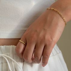 Our Paperclip bracelet is a golden staple to wear alone or stack with our other gold filled bracelets. Our 14k gold-filled jewelry is bonded with 14k gold and is water and tarnish resistant. 14k gold-filled jewelry is a great alternative to solid gold, and can be worn by people with sensitive skin. The color will not tarnish but recommend to keep away from perfumes and lotions. - 14k gold-filled- Chain width: 3.5 mm.- Chain length: 6"- Water resistant / Tarnish resistant / Hypoallergenic Adjustable Gold-tone Paperclip Bracelet For Everyday, Gold-tone Gold-plated Paperclip Bracelet For Everyday, Everyday Hypoallergenic 14k Gold Chain Bracelet, Dainty Adjustable 14k Gold Paperclip Bracelet, Gold Plated Minimalist Paperclip Bracelet, Dainty 14k Gold-filled Paperclip Bracelet For Everyday, Dainty 14k Gold Filled Paperclip Bracelet For Everyday, Gold-tone Tarnish Resistant Paperclip Bracelet, Minimalist Rectangular Link Jewelry Tarnish Resistant