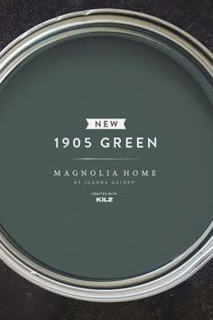 a metal pan with the words new 1055 green in white on it and an image of