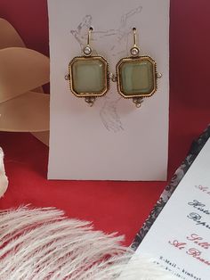 I saw these earrings and knew they were perfect to offer in the shop.  They are gold plated earwires with a square glass green intaglio and pearl elements.  Perfect to wear for late 18th century, early 19th century on up to today.  I love them! They measure 1-1/4 inches long by just over 1/2 inch wide.  The earwire is super long which is good to stay in the ear. Lots of inspiration on my Pinterest page.  https://www.pinterest.com/kkwalte/_saved/ Antique Brass Earrings For Party, Elegant Rectangular Clip-on Earrings For Formal Events, Antique Nickel-free Earrings For Party, Yellow Gold Pierced Crystal Earrings For Gift, Pierced Yellow Gold Crystal Earrings As Gift, Yellow Gold Pierced Crystal Earrings As Gift, Elegant Square Gold Jewelry, Victorian Brass Earrings For Party, Victorian Style Nickel Free Earrings For Party