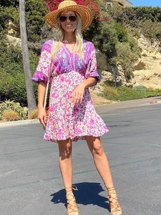 The Emes Shop dress is detailed with a feminine ruffle hem. Features a v neck line. 3/4 length sleeves. floral prints. gartered waist. and above knee length. Pair it with sunnies and sandals for a fun look.MATERIAL:100% Brushed Poly MEASUREMENTS:Dress Length is 34-36in Small | Bust: 44-46in & Waist: 26-28in Medium | Bust: 46-48in & Waist: 28-30in Large | Bust: 48-50in & Waist: 30-32in X Large | Bust: 50-52in & Waist: 32-34in MEASUREMENTS:Dress Length is 86-91in Small | Bust: 111-116cm & Waist: 66-71cm Medium | Bust:116-121cm & Waist: 71-76cm Large | Bust: 121-126cm & Waist: 76-81cm X Large | Bust: 126-131cm & Waist: 81-86cm Shop Dress, Boho Floral Dress, Floral Ruffle, Large Bust, Small Bust, Above Knee, Ruffle Hem, Boho Dress, Pink And Orange