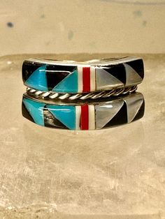 Turquoise ring Zuni band Coral southwest size 5.75 sterling silver girls women  Signed Q.T. Size 5.75 Between a size 5.75 and a size 6 Weight  3.8g Width  3/8" Thinnest part od band in back  3/16" Free Shipping & Free Postal Insurance  Delivered in a Gift Box  Free First Class shipping and postal insurance is included. If you want to upgrade to priority kindly pay an additional fee to do so.  This is recommended if you would like to have your package delivered faster than first class which has s Southwestern Multi-stone Rings For Anniversary, Southwestern Style Rings With Inlay, Southwestern Round Rings With Inlay, Multicolor Southwestern Sterling Silver Turquoise Ring, Multicolor Southwestern Style Turquoise Ring In Sterling Silver, Adjustable Multicolor Turquoise Ring In Southwestern Style, Adjustable Multi-stone Turquoise Ring In Silver, Multicolor Southwestern Turquoise Sterling Silver Ring, Adjustable Silver Turquoise Multi-stone Ring