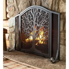 a fire place sitting on top of a stone fireplace