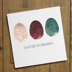 an easter card with three eggs in different colors and the words, easter is coming