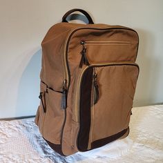 Tough Canvas With Great Hand Feel, Quality Materials, Tons Of Zippers Pockets And Compartments. Padded Interior Compartment For Laptop With Thick Velcro Stap. Bottle Holder (Bottle Not Included) Burks Bay Quality Casual Brown Bags With Zipper Pocket, Brown Rectangular Backpack With Zipper Pocket, Casual Light Brown Travel Bag, Casual Travel Bag With Zipper Pocket, Brown School Backpack With Zipper Pocket, School Backpack With Zipper Pocket In Brown, Casual Brown Bag With Zipper Closure, Casual Beige Backpack With Zipper Closure, Casual Light Brown Bags With Zipper Closure