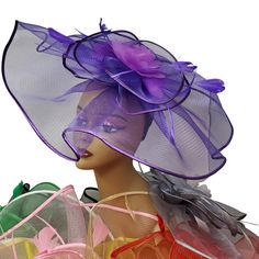 Lady Diane Collection Fascinator Style Style: FA-776 Multiple Color Choices! Topped with satin trim & floral ribbons and flying feather accents Size: Diameter- 13" inches Includes Headband Sign-up for our Rewards Program just go to the icon on right side of this page Follow the instructions, it's quick and easy Spring Party Tulle Headpiece, Spring Party Feather Trim Fascinator, Spring Fascinator For Costume Party, Purple Feather Headpieces For Spring, Summer Purple Feathered Fascinator, Purple Feathered Costume Hats And Headpieces For Party, Purple Feathered Costume Hats For Party, Purple Headpieces For Spring Races, Purple Feathered Mini Hat For Summer