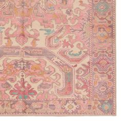 an antique rug with pink and blue colors