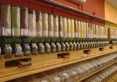 the shelves are filled with many different kinds of spices