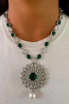 Silver toned layered necklace embellished with white diamonds, semi precious green emerald stones and a pair of matching earrings. Comes with a circle diamond and emerald stone embellished pendant necklace and a pair of matching earrings. - Aza Fashions Layered Necklace Set, Circle Pendant Necklace, Circle Diamond, Green Jewelry, Green Diamond, Emerald Stone, Circle Pendant, Online Jewelry, Layered Necklaces