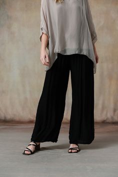 You'll swoon over our Madelyn Pants, where luxurious Italian silk meets impeccable design. These pants feature a comfortable waistband and a flattering wide-leg cut, offering a perfect blend of elegance and ease. Available in stunning colorways that seamlessly coordinate with our effortless tops and cozy knitwear, the Madelyn Pants make full-body dressing an art form. Part of our mix-and-match Italian Silk assortment. Classic fit. One size fits most. Full-length wide-leg pant, foldable jersey wa Elegant Black Wide Leg Viscose Pants, Elegant Black Viscose Wide Leg Pants, Loosely Fitted Viscose Wide Leg Pants, Elegant Ankle-length Viscose Wide Leg Pants, Elegant Relaxed Fit Silk Pants, Elegant Silk Pants With Relaxed Fit, Elegant Relaxed Fit Viscose Bottoms, Relaxed Fit Viscose Wide-leg Pants, Elegant Silk Bottoms With Relaxed Fit