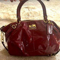 Coach Red Patent Leather Handbag. 2 Unnoticeable Stain Areas As Pictured. Gently Used. Designer Burgundy Bag With Detachable Strap, Designer Burgundy Crossbody Satchel, Designer Burgundy Bag With Handles, Red Coach Bag For On-the-go, Designer Coach Shoulder Bag In Burgundy, Designer Coach Burgundy Shoulder Bag, Designer Burgundy Coach Shoulder Bag, Red Handheld Bag With Gold-tone Hardware, Burgundy Satchel With Double Handle