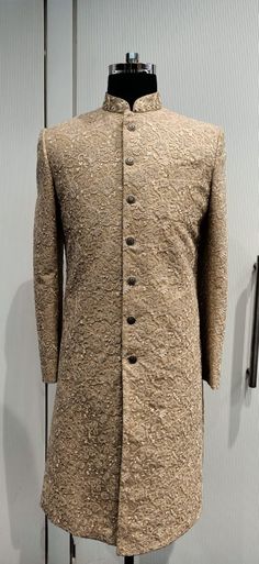 a coat is on display in front of a wall