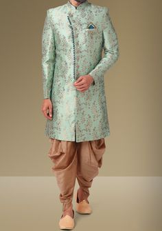 Ready-Made Sherwani With Trouser. Jacquard Brocade Fabric Top. Art Dupion Peshawari Ready Made Trouser. Crafted in Chinese Collar Neck, and Full Sleeve. Satin Lining with Plain Work. High-Quality Matching Buttons. Please Note: The footwear shown in the picture is for presentation and photography purpose only. Color: There might be slight color variation due to lightings and flashes while photo shooting. The color may also vary because of different screen resolutions. Wash Care: Dry Clean Only. Traditional Drape Kurta In Pista Green For Transitional Season, Pista Green Traditional Drape Kurta For Transitional Season, Transitional Traditional Drape Pista Green Kurta, Formal Pista Green Bandhgala With Traditional Drape, Pista Green Sherwani For Formal Eid Celebrations, Formal Pista Green Sherwani For Eid, Pista Green Traditional Drape Bandhgala For Designer Wear, Pista Green Designer Wear Sherwani, Pista Green Bandhgala With Dabka Embroidery