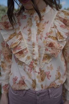 We are really stepping up our blouse game this spring! Florals are forever our favorite pattern. Victorian style top Front button down closure Ruffle detail 100% polyester Long sleeve that comes shorter than the wrist Models are 5'4" and wearing a size small. The length of a size small is 19.5". Small: 2-4 Medium: 6-8 Large: 10-12 Spring Bohemian Blouse With Buttons, Bohemian Spring Blouse With Buttons, Trendy Spring Blouse With Ruffled Collar, Spring Bohemian Button-up Tops, Printed Shirt For Day Out In Fall, Printed Shirt For Fall Day Out, Trendy Spring Blouse With Ruffles, Collared Shirt With Buttons For Spring, Spring Collared Blouse With Buttons