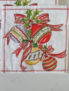 two napkins with christmas decorations on them