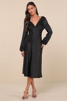 The Lulus Illustrious Elegance Black Satin Long Sleeve Midi Dress is stunning, sweet, and will sweep everyone off their feet! Sleek, stretch-woven satin shapes this stunning dress that features a lightly gathered bodice with a plunging, lace-trimmed V-neck and back, all framed by long balloon sleeves with matching lace trim and elastic at the cuffs. The chic, empire-style waist sits atop the fit-and-flare silhouette that falls to a modern midi hem. Hidden back zipper/clasp. Fit: This garment fit Satin V-neck Night Dress, Night V-neck Dress With Satin Finish, Stretch Satin Midi Dress, Sleek Satin V-neck Midi Dress, Fitted V-neck Satin Dress With Bias Cut, Fitted Silk Dress With Satin Finish And V-neck, Fitted Silk V-neck Dress For Date Night, Satin Stretch Midi Dress, Stretch Satin Knee-length Dress