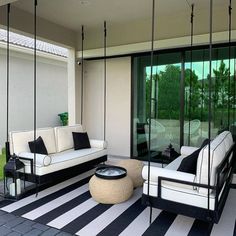 a living room with black and white furniture