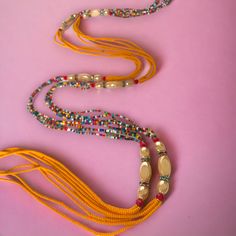 **DRIP FAIRY IS CURRENTLY OPEN FOR PRE-ORDERS ONLY! ALL ORDERS WILL NOT BE SHIPPED OUT UNTIL FEBRUARY 24, 2024. AS A THANK YOU TO THOSE PRE-ORDERING THESE ORDERS WILL ALSO INCLUDE A FREE GIFT! This handmade Ivorian waist bead has an incredibly beautiful four strand design in the colors of purple, gold, and red. Each waist bead is carefully crafted using a combination of strong threads woven together to create a durable and long-lasting piece. The beads themselves are made from glass and each one is carefully chosen to ensure a consistent look and feel to the waist bead. Crafted using high-quality materials, this waist bead is durable and designed to last. The strands provide a comfortable and secure fit, while the adjustable length ensures that it can fit a wide range of waist sizes. The p Festive Spiritual Beaded Necklaces With Colorful Beads, Festive Spiritual Beaded Necklace With Colorful Beads, Multi-strand Beaded Waist Beads For Festival, Spiritual Beaded Waist Beads For Beach, Festive Bohemian Beaded Necklaces With Tiny Beads, Festive Bohemian Beaded Necklace With Tiny Beads, Festive Artisan Adjustable Beaded Necklaces, Bohemian Style Colorful Waist Beads, Multi-strand Beaded Bracelets With Large Beads For Festivals