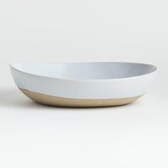 a white and gold bowl on a white background