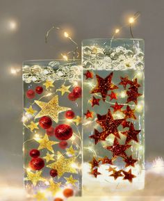 two clear vases filled with red and gold stars