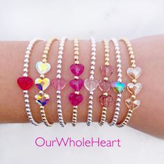 All of our bracelets are handmade in Hoboken, NJ, a little town which is near and dear to our hearts. This beautiful Swarovski heart bracelet is completely customizable - chose a single crystal heart or three. Also choose from 8 colors: red, fuchsia, rose, dusty lilac, mermaid, unicorn, clear, and silk. One inch of extra chain lets you adjust the bracelet to your preference. All items are hand-made in the USA in a smoke-free studio, and most importantly, they're made with OurWholeHeart❤︎ ------- Silver Beaded Crystal Bracelet For Valentine's Day, Valentine's Day Silver Beaded Crystal Bracelet, Heart-shaped Bracelets With Faceted Beads For Gifts, Heart-shaped Bracelet With Faceted Beads For Gifts, Beaded Heart Bracelet Gift, Heart Shaped Bracelets With Faceted Beads For Gifts, Heart-shaped Faceted Beads Bracelet Gift, Valentine's Day Adjustable Beaded Bracelets With Faceted Beads, Valentine's Day Adjustable Bracelets With Faceted Beads