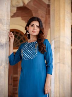 A charming blue and rayon kurta, meticulously adorned with yoke design & Chikankari detailing. The straight shape enhances its elegant silhouette, making it a perfect blend of traditional craftsmanship and contemporary style. Single Piece Fabric: Rayon Color: Blue Neck: Round Neck Sleeve: 3/4th Sleeves Style - Straight Shape with Regular Style Work Done: Yoke Design with Chikankari Detailing Length - Calf Length Washing Instructions: Hand Wash Size & Fit - Model's height is 5'8 wearing size smal Yoke Design, Sleeves Style, Womens Size Chart, Single Piece, Washing Instructions, Contemporary Style, Sleeve Styles, Fitness Models, Round Neck