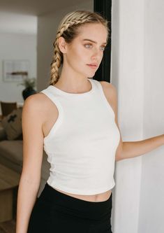 The Bliss Rib Tank is the go-to tank for any look. Whether you're styling it with yoga pants, jeans, or a skirt, its ultra-soft Airlume cotton and mid-length cut provide a comfortable, stretchy fit that perfectly frames your body. Plus, the timeless high-neck and racerback silhouette make it a staple style for any wardrobe. FitThis style runs true to size. 19" long measuring from a small. Size range = XS 0-2, S 2-4 M 6-8, L 10-12, XL 14-16. FabricMoisture wicking, ultra soft micro rib jersey, 52 Crochet Tank Top, Tank Top Dress, Muscle Tank, Muscle Tanks, Pants Jeans, Yoga Leggings, A Skirt, Crop Tank, Classic White