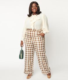 An iconic pair of plus size slacks, crafted in woven fabric that features a brown and ivory plaid pattern throughout, and secured with a front zipper, button, and an elastic waistband. Outfitted with side pockets and wide cuffs. Available in sizes XS-5X while supplies last. Business Casual Plus Size, Internship Outfit, Cuff Pants, Business Girl, Business Casual Outfit, Plus Size Work, Vintage Plus Size, Work Fits, Soft Gamine