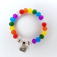 Taste The Rainbow Love Bracelet Handmade By Me Crystal Beaded Stretch Bracelet 7.5" Length Tibetan Silver Heart Charm Rhinestone Accents Simulated Crystal & Gemstone Beads New Ring Not Included Multicolor Bracelets With Heart Charm And Round Beads, Multicolor Stretch Bracelet With Heart Beads, Multicolor Round Beads Bracelet With Heart Charm, Adjustable Rainbow Beaded Bracelets With Heart Beads, Adjustable Multicolor Heart Beads Bracelet, Adjustable Multicolor Beaded Heart Bracelet, Multicolor Heart Beads Stretch Bracelet, Pride Bracelet Diy, Multicolor Heart Charm Bracelets With Round Beads