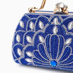 Introducing the Augustine Pearls Handbag - an enchanting masterpiece crafted to elevate your evening attire to unprecedented levels of sophistication. This clutch exudes magnificence in every detail, adorned with shimmering rhinestones and delicate pearl accents. Remarkably lightweight, it guarantees seamless carrying all through the night without compromising on style. Now available in blue, black, silver, and red. Glamorous Pearl Embellished Rectangular Evening Bag, Handheld Pearl-embellished Clutch For Events, Pearl Embellished Clutch Evening Bag, Pearl Embellished Clutch For Evening, Glamorous Pearl-embellished Evening Bag, Elegant Pearl Embellished Evening Bag, Luxury Pearl-embellished Clutch Evening Bag, Luxury Pearl Embellished Clutch Bag, Luxury Pearl Embellished Clutch Evening Bag