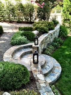 an outdoor garden with stone steps and plants