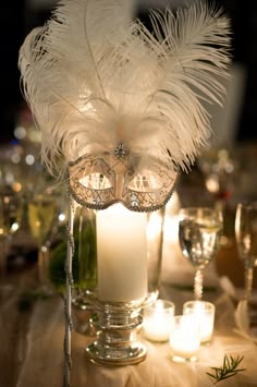 a collage of photos with candles, masks and feathers on them in different colors