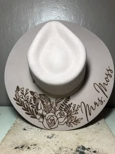 a white hat sitting on top of a counter